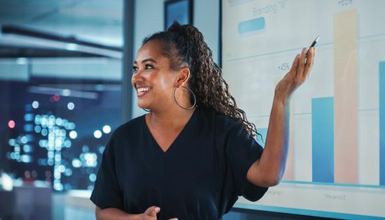 Individual pointing at screen